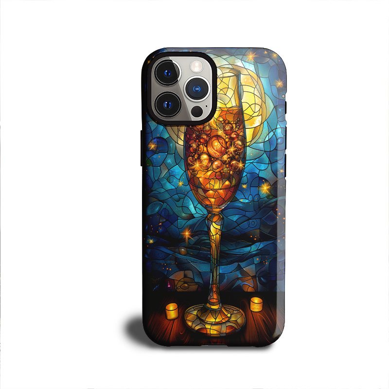 Phone case with a stained glass-style wine glass filled with golden bubbles, glowing under a starry night sky and full moon.